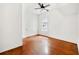 Cozy bedroom with hardwood floors, white walls, and a ceiling fan at 3288 Dogwood St, Atlanta, GA 30337