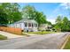Charming home featuring a inviting front porch, complemented by a well-maintained lawn at 3288 Dogwood St, Atlanta, GA 30337