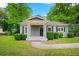Inviting home with a quaint covered porch and well-maintained front yard at 3288 Dogwood St, Atlanta, GA 30337