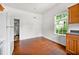 Sunny kitchen view showcasing cabinets, countertop and hardwood floors at 3288 Dogwood St, Atlanta, GA 30337