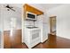 Efficient kitchen featuring modern appliances, wooden cabinets and hardwood floors at 3288 Dogwood St, Atlanta, GA 30337