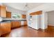 Well-lit kitchen with wood cabinets, sleek countertops, and modern appliances at 3288 Dogwood St, Atlanta, GA 30337