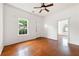 Light-filled living room showcasing hardwood floors, white walls, and a ceiling fan at 3288 Dogwood St, Atlanta, GA 30337