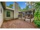Backyard area featuring a screened-in porch, small deck, and landscaping at 5535 Dorsett Shoals Rd, Douglasville, GA 30135
