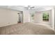 Bedroom with neutral carpet, windows, and ceiling fan at 5535 Dorsett Shoals Rd, Douglasville, GA 30135