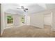 Bedroom with neutral carpet, windows, and ceiling fan at 5535 Dorsett Shoals Rd, Douglasville, GA 30135