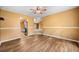 Open dining area featuring hardwood floors and a view to the kitchen at 5535 Dorsett Shoals Rd, Douglasville, GA 30135