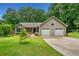 Inviting home with well-maintained lawn, two-car garage, and classic design at 5535 Dorsett Shoals Rd, Douglasville, GA 30135