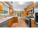 Bright kitchen featuring stainless steel appliances and wooden cabinetry at 5535 Dorsett Shoals Rd, Douglasville, GA 30135
