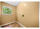 Laundry room with window and wood style flooring at 5535 Dorsett Shoals Rd, Douglasville, GA 30135