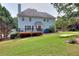 Spacious backyard with a deck and a view of the home at 662 Shady Willow Ln, Loganville, GA 30052