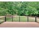 Enjoy the view from this spacious deck overlooking the tree-lined backyard at 662 Shady Willow Ln, Loganville, GA 30052