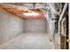 Unfinished basement with concrete floors and exposed duct work, ideal for storage or workshop at 662 Shady Willow Ln, Loganville, GA 30052