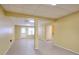 Finished basement with tile floors, neutral paint, and access to the upper levels at 662 Shady Willow Ln, Loganville, GA 30052