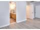 Bedroom with wood floors providing access to the bathroom at 662 Shady Willow Ln, Loganville, GA 30052