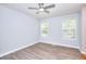 Bedroom with ample natural light, ceiling fan and vinyl flooring at 662 Shady Willow Ln, Loganville, GA 30052