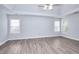 Spacious bedroom featuring hardwood floors, lots of natural light, and a ceiling fan at 662 Shady Willow Ln, Loganville, GA 30052