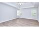 Spacious bedroom with hardwood floors, lots of natural light, and a ceiling fan at 662 Shady Willow Ln, Loganville, GA 30052