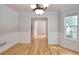 Elegant dining room featuring wainscoting, hardwood floors, and an open layout at 662 Shady Willow Ln, Loganville, GA 30052
