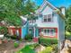 Lovely two-story home featuring a blend of blue siding, brick accents, and well-placed windows at 662 Shady Willow Ln, Loganville, GA 30052