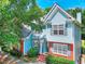 Lovely two-story home featuring a blend of blue siding, brick accents, and well-placed windows at 662 Shady Willow Ln, Loganville, GA 30052