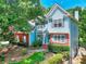 Lovely two-story home featuring a blend of blue siding, brick accents, and well-placed windows at 662 Shady Willow Ln, Loganville, GA 30052