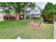 Inviting two-story home featuring a lush green lawn and nicely landscaped garden beds at 662 Shady Willow Ln, Loganville, GA 30052