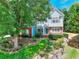 Charming two-story home with a well-manicured lawn, mature trees, and a mix of brick and siding exterior at 662 Shady Willow Ln, Loganville, GA 30052
