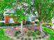Charming two-story home with brick facade, blue siding, well-maintained landscaping, and mature trees at 662 Shady Willow Ln, Loganville, GA 30052