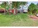 Charming two-story home with brick and siding, situated on a well-maintained lot with mature trees and landscaping at 662 Shady Willow Ln, Loganville, GA 30052