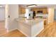 Open kitchen features granite countertops, stainless steel appliances and wood cabinets at 662 Shady Willow Ln, Loganville, GA 30052