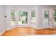 Sunroom with large bay windows and an exterior door opening to a patio at 662 Shady Willow Ln, Loganville, GA 30052