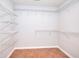Spacious walk-in closet with wire shelving throughout and tile flooring at 662 Shady Willow Ln, Loganville, GA 30052