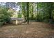 Large backyard with mature trees offering plenty of space for recreation and relaxation at 118 Lucia Dr, Smyrna, GA 30082