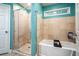 This bathroom includes a walk-in shower, soaking tub, and tiled floors, a modern design at 118 Lucia Dr, Smyrna, GA 30082