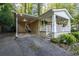 View of the carport with a cozy front porch including charming decorations at 118 Lucia Dr, Smyrna, GA 30082