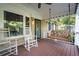 Cozy front porch with rocking chairs and swing, perfect for relaxing outdoors at 118 Lucia Dr, Smyrna, GA 30082