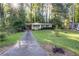 Charming home with well-manicured lawn and inviting front porch, showcasing curb appeal at 118 Lucia Dr, Smyrna, GA 30082