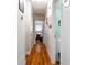 Bright hallway with hardwood floors and white walls provides access to various rooms in the house at 118 Lucia Dr, Smyrna, GA 30082