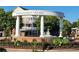 View of Smyrna Market Village with beautiful landscaping and a water fountain at 118 Lucia Dr, Smyrna, GA 30082