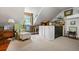 Attic space with neutral carpet, sloped ceilings and custom storage at 1691 Whitlock Rd, Marietta, GA 30066