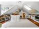 Spacious attic features wood accents, recessed lights and custom storage at 1691 Whitlock Rd, Marietta, GA 30066