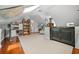 Spacious attic featuring hardwood floors, sloped ceilings and custom storage at 1691 Whitlock Rd, Marietta, GA 30066