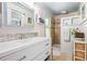 Charming bathroom with white vanity, decorative wainscoting, tiled floors, and a walk-in shower at 1691 Whitlock Rd, Marietta, GA 30066
