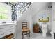 Charming bathroom features stylish floral wallpaper and modern fixtures at 1691 Whitlock Rd, Marietta, GA 30066