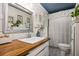 Bright bathroom with subway tile backsplash, wood countertop, and patterned tile floor at 1691 Whitlock Rd, Marietta, GA 30066
