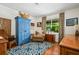 Charming bedroom with hardwood floors, patterned curtains and traditional furnishings at 1691 Whitlock Rd, Marietta, GA 30066