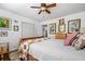 Cozy bedroom featuring a ceiling fan, white walls, and natural light at 1691 Whitlock Rd, Marietta, GA 30066
