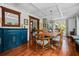 Dining room featuring wood floors, a coffered ceiling, large windows and rustic wood furniture at 1691 Whitlock Rd, Marietta, GA 30066