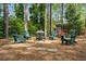 Wood burning fire pit surrounded by Adirondack chairs for entertaining at 1691 Whitlock Rd, Marietta, GA 30066